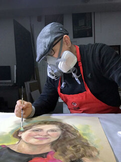 Marcelo Pazan Cleaning artwork with brush